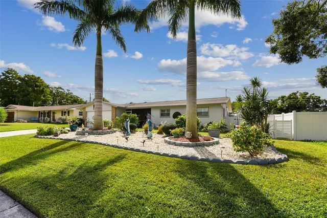a view of a dining table and chairs in the balcony