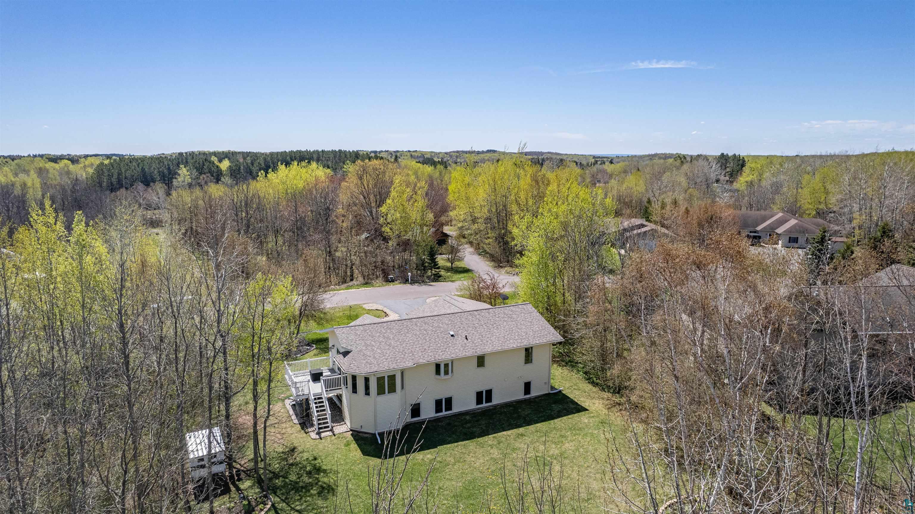 4809 Oak Ridge Drive Hermantown, MN 55811 - Photo 5 of 69 Two-story residence featuring light-toned siding, a gray shingle roof, and multiple windows