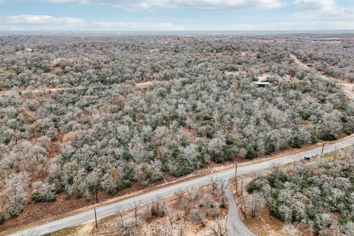 0 Flash Circle Luling, TX 78648 - Photo 4 of 15 Aerial overview of property's location featuring a heavily wooded area