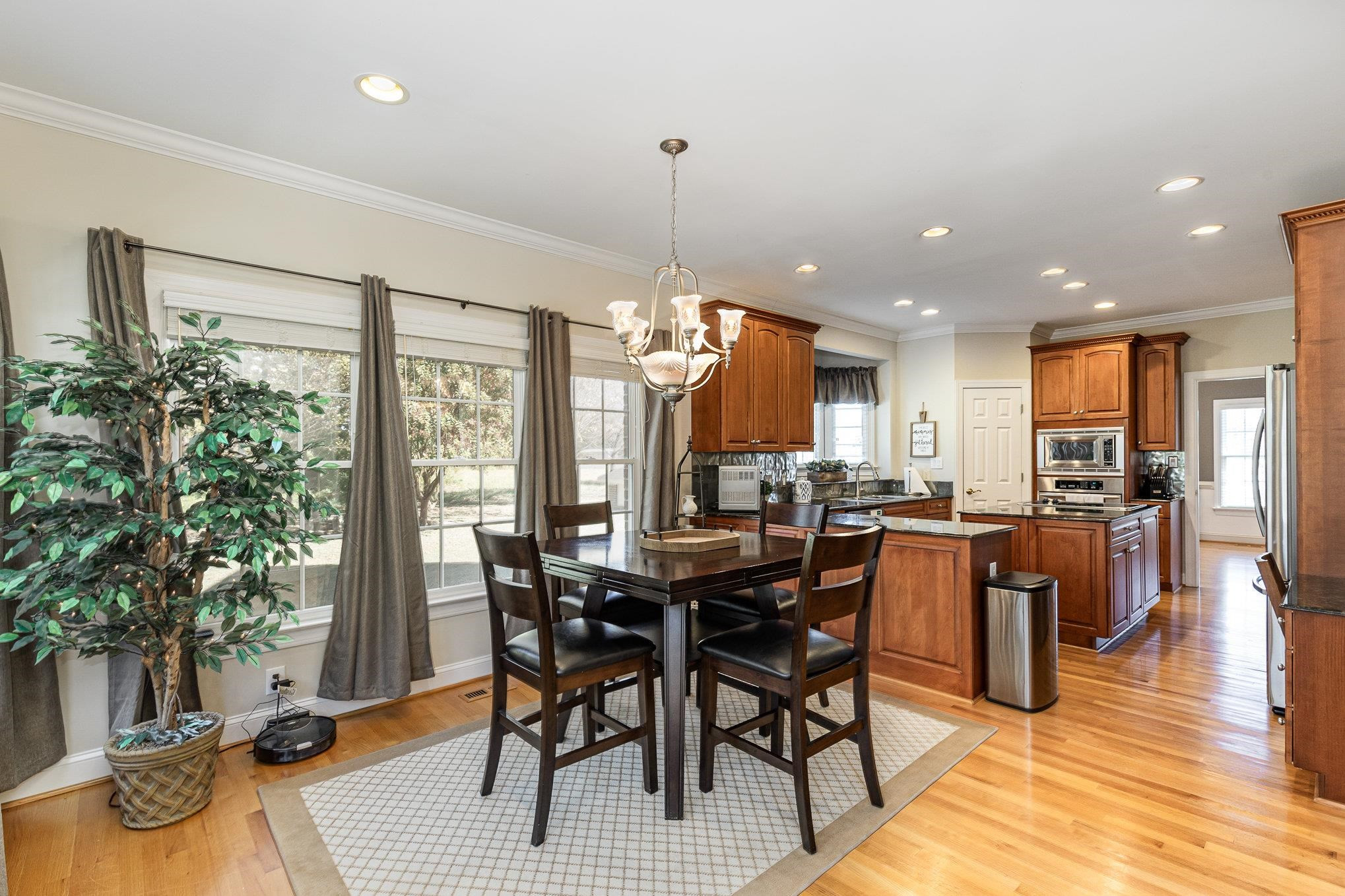 4046 Fairground Road Dunn, NC 28334 - Photo 12 of 50 a view of a dining room with furniture window and wooden floor