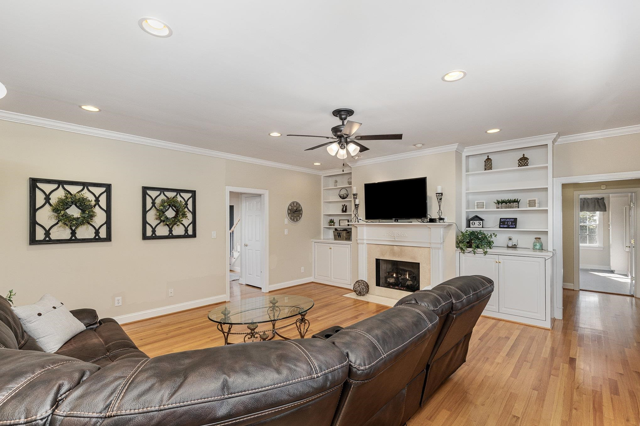 4046 Fairground Road Dunn, NC 28334 - Photo 14 of 50 a living room with furniture a flat screen tv and a fireplace