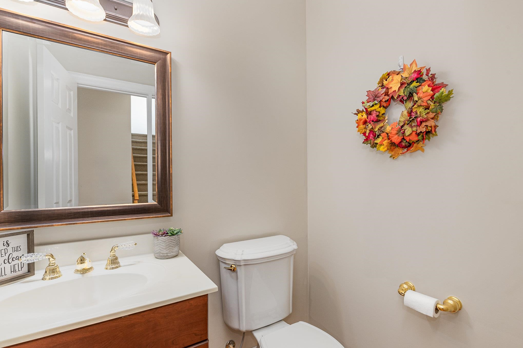 4046 Fairground Road Dunn, NC 28334 - Photo 18 of 50 a bathroom with a sink mirror and toilet
