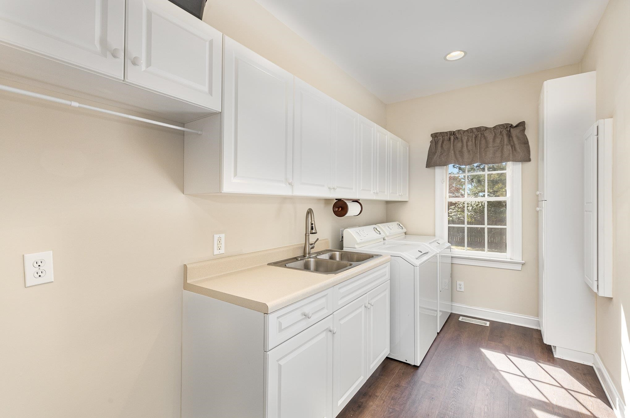 4046 Fairground Road Dunn, NC 28334 - Photo 20 of 50 a utility room with a sink dryer and washer