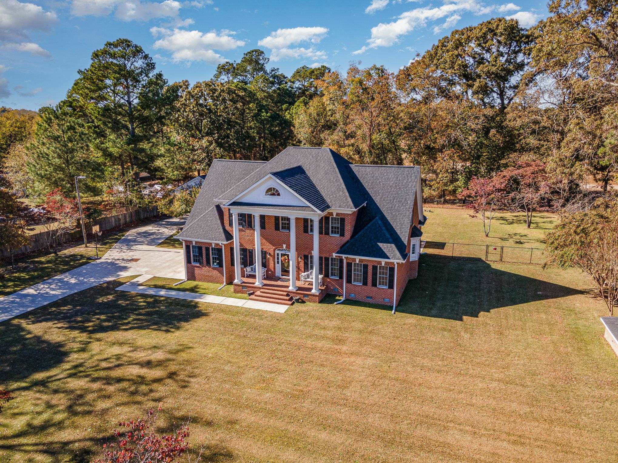 4046 Fairground Road Dunn, NC 28334 - Photo 25 of 50 a front view of a house with a yard and garage