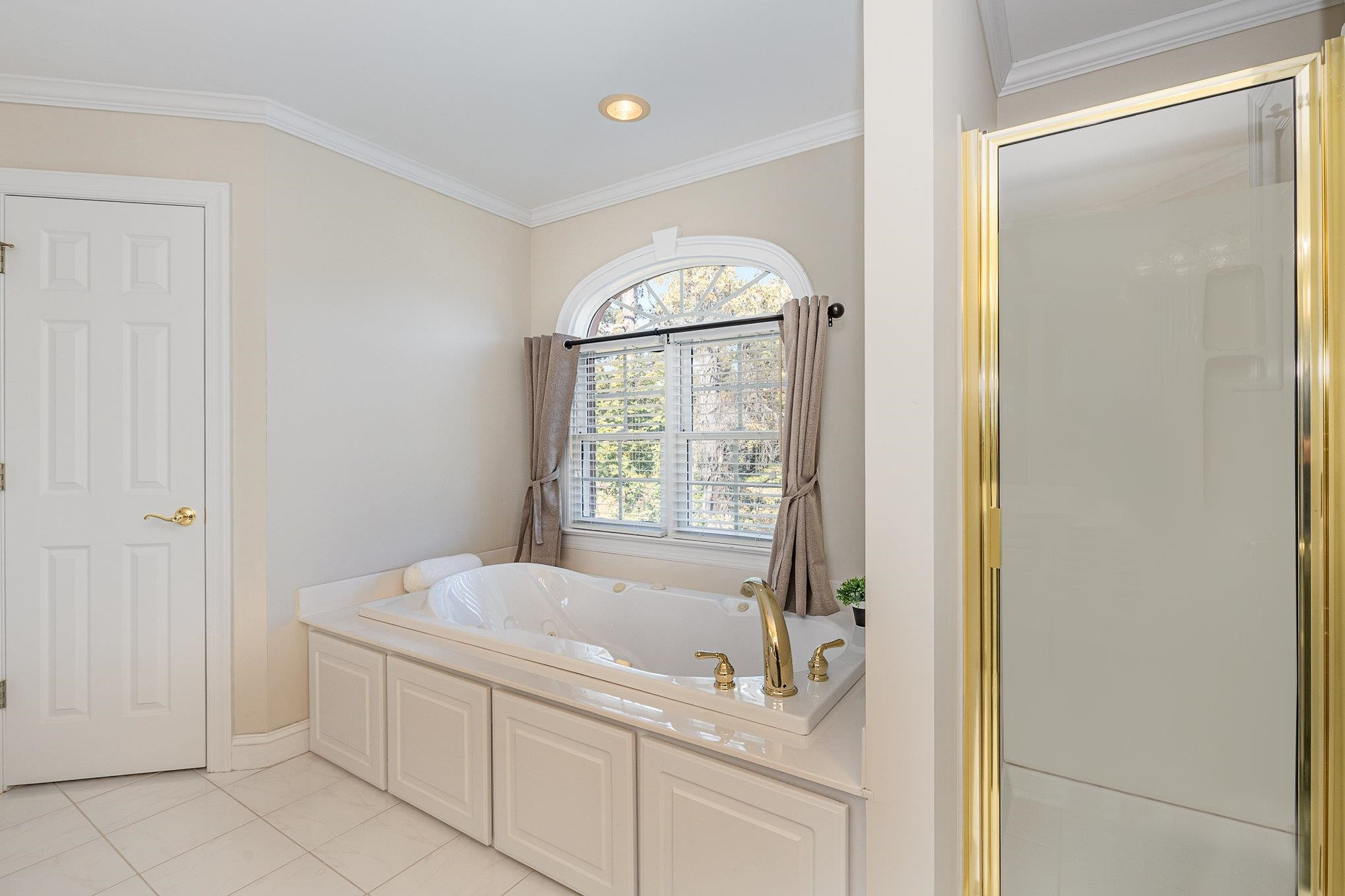 4046 Fairground Road Dunn, NC 28334 - Photo 29 of 50 a spacious bathroom with a bathtub and a shower