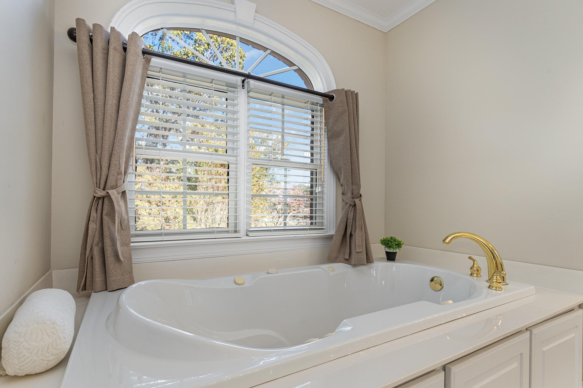 4046 Fairground Road Dunn, NC 28334 - Photo 30 of 50 a white bath tub sitting next to a window