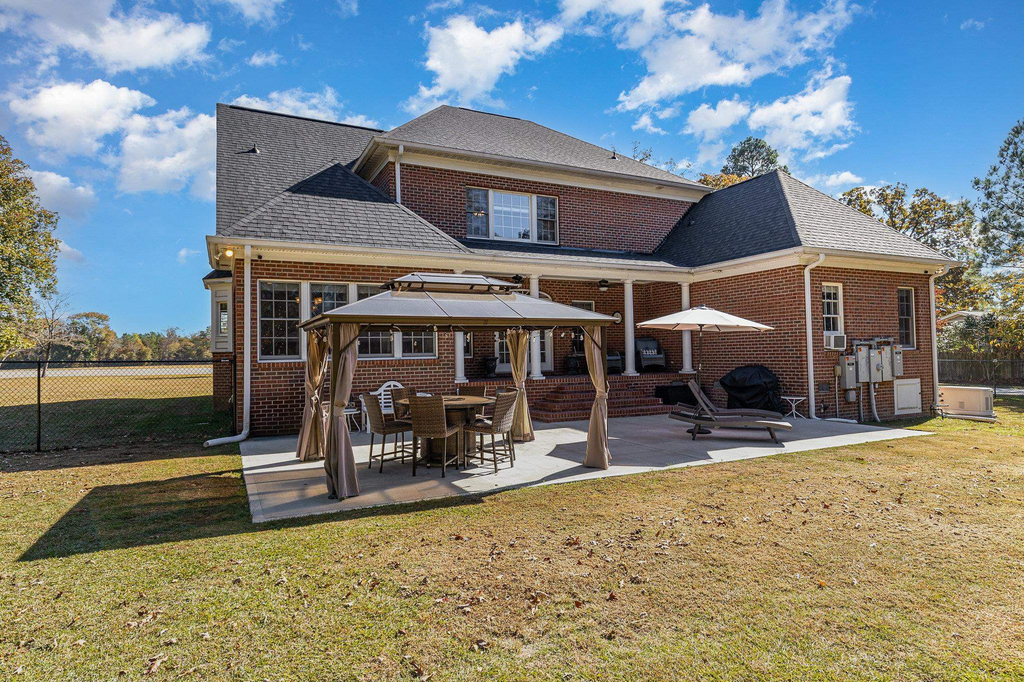 4046 Fairground Road Dunn, NC 28334 - Photo 38 of 50 a view of a house with patio