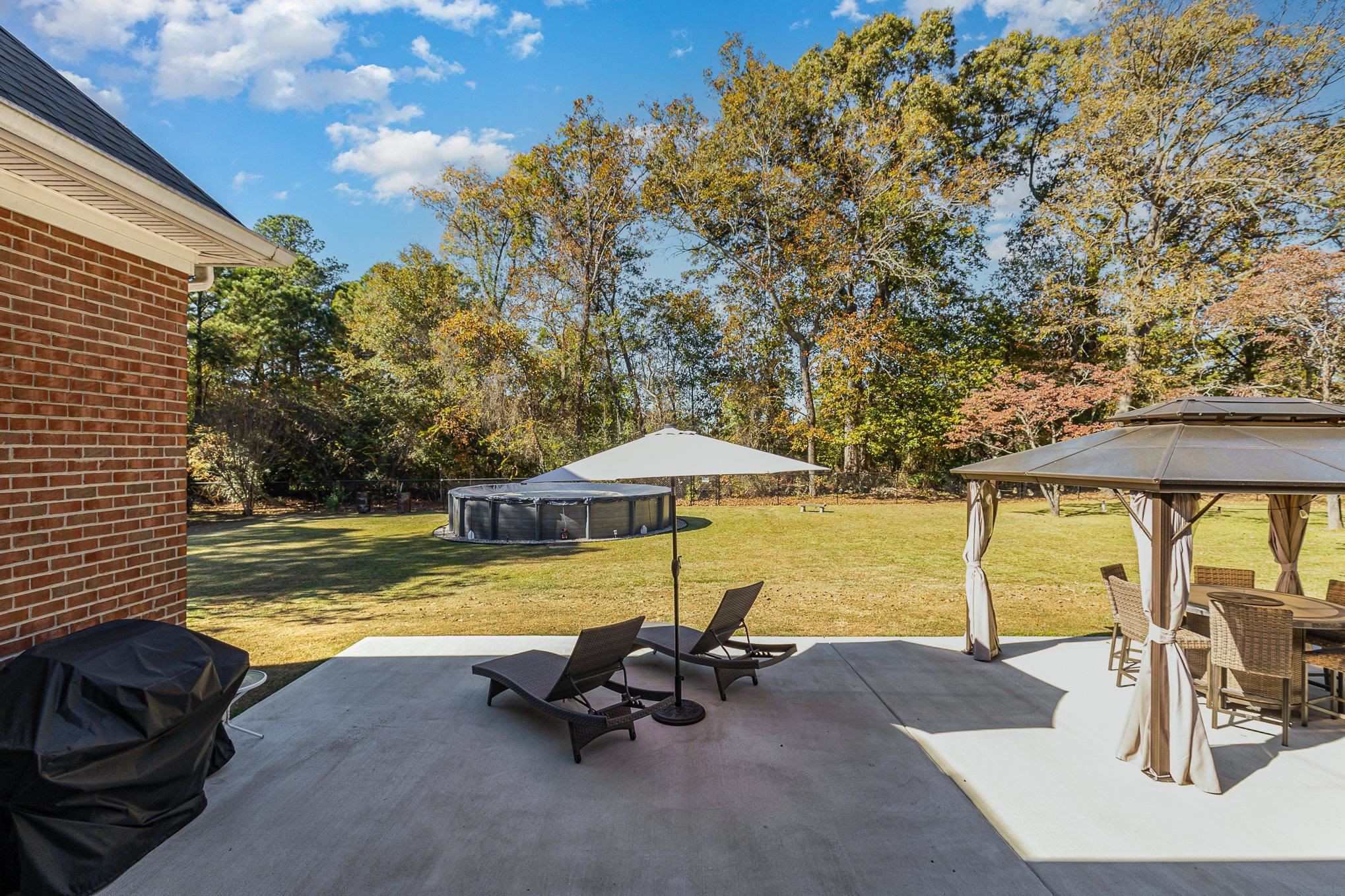 4046 Fairground Road Dunn, NC 28334 - Photo 42 of 50 a view of a swimming pool with a lounge chair