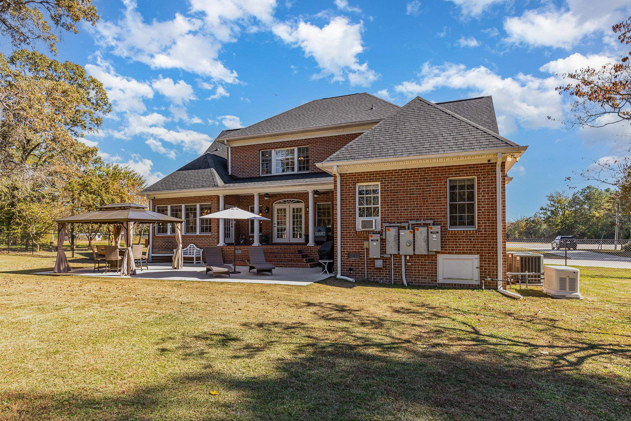 4046 Fairground Road Dunn, NC 28334 - Photo 45 of 50 a front view of a house with yard porch and furniture