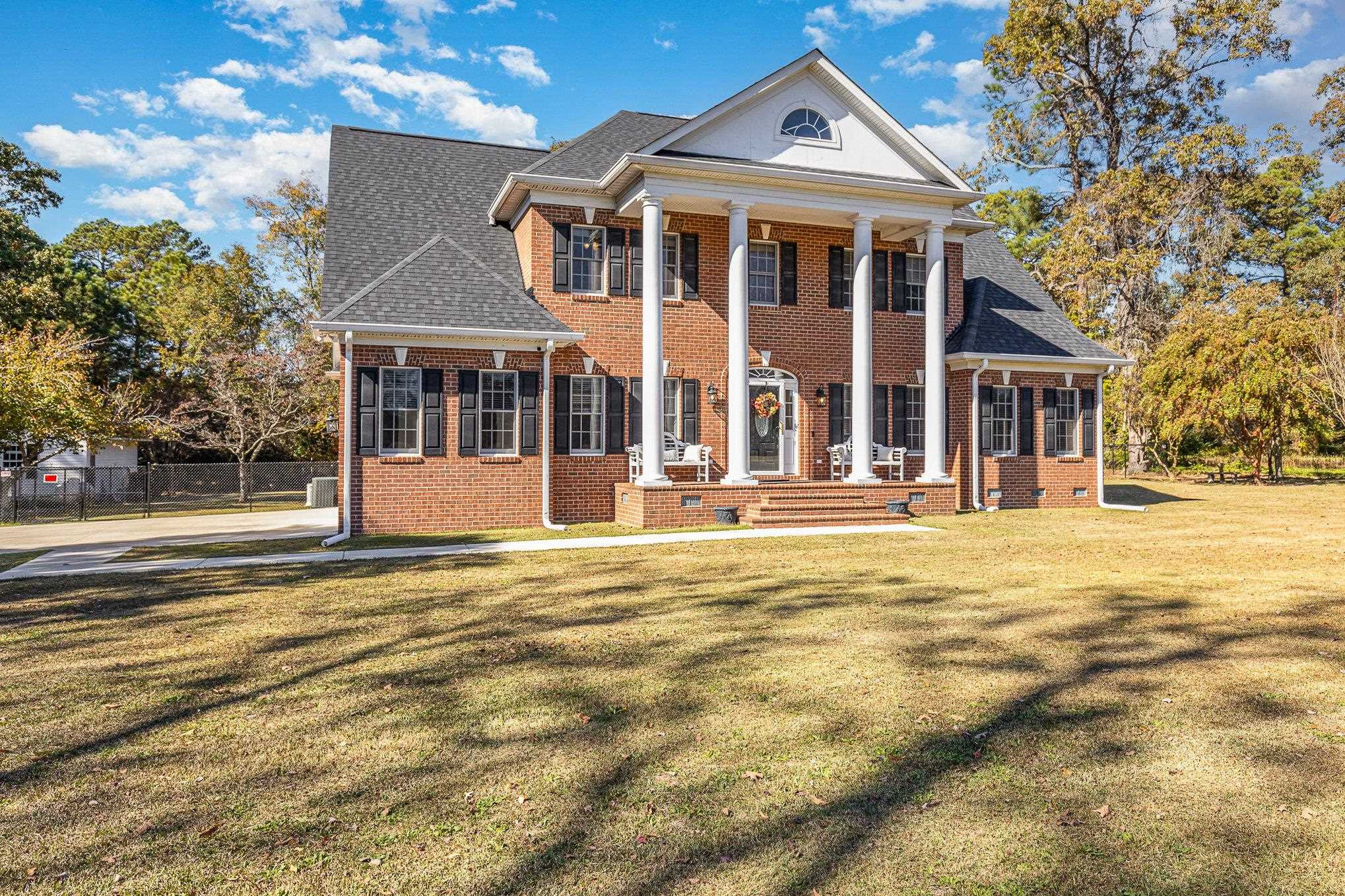 4046 Fairground Road Dunn, NC 28334 - Photo 46 of 50 a front view of a house with a yard