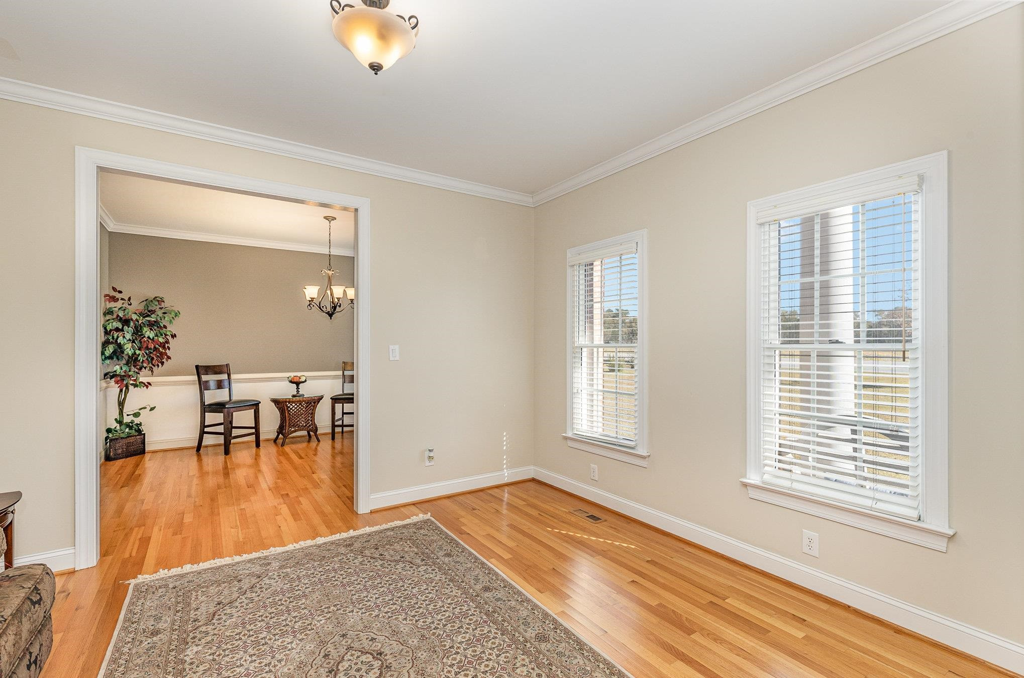 4046 Fairground Road Dunn, NC 28334 - Photo 6 of 50 a view of empty room with wooden floor and fan