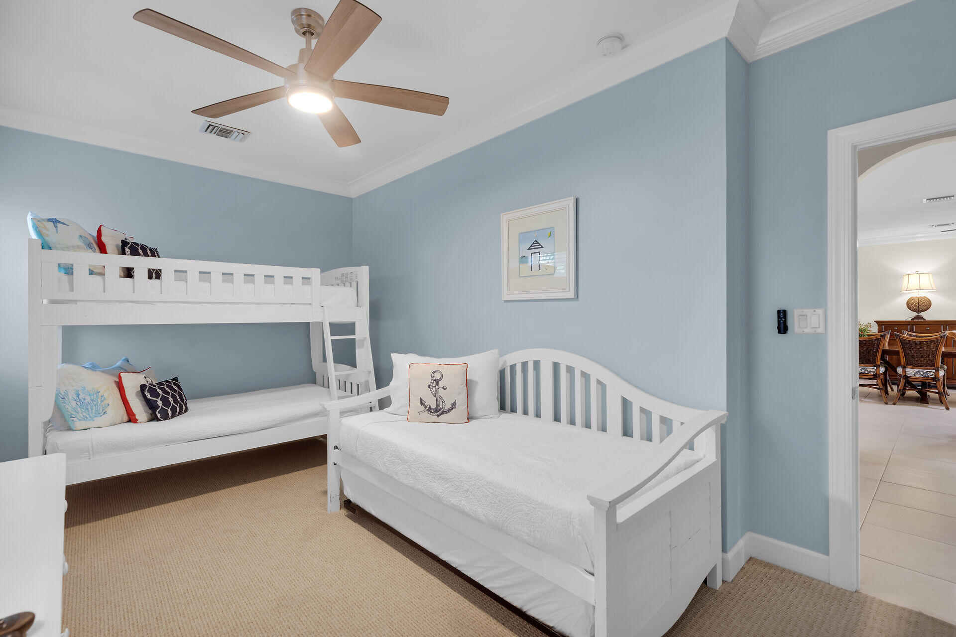 580-590 10th Street Key Colony Beach, FL 33051 - Photo 44 of 75 a white bed sitting in a bedroom next to a window