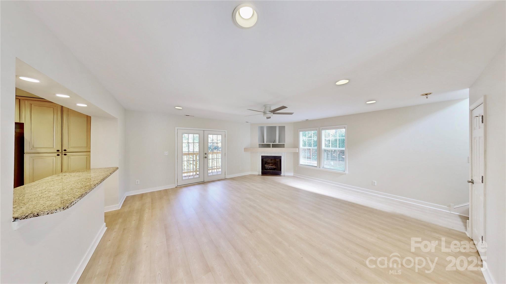 2844 Goneaway Road Charlotte, NC 28210 - Photo 17 of 41 a view of an empty room with window and wooden floor