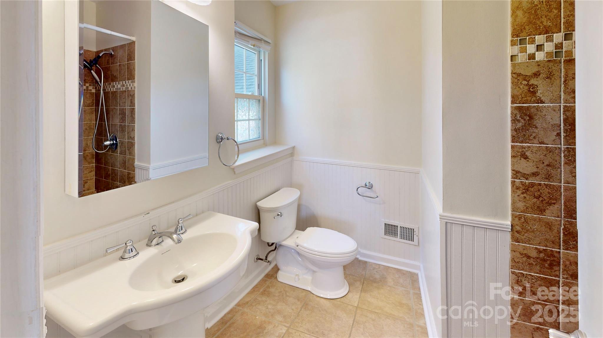 2844 Goneaway Road Charlotte, NC 28210 - Photo 28 of 41 a bathroom with a sink and a toilet