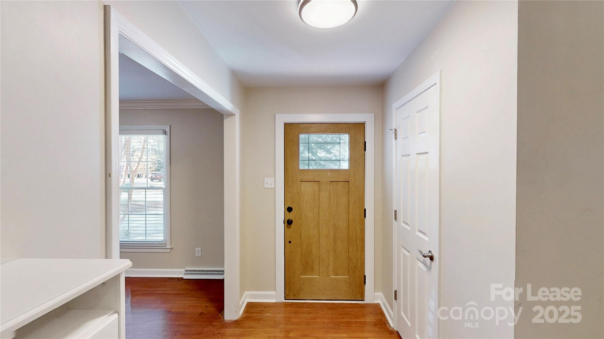 2844 Goneaway Road Charlotte, NC 28210 - Photo 3 of 41 a view of an entryway with wooden floor
