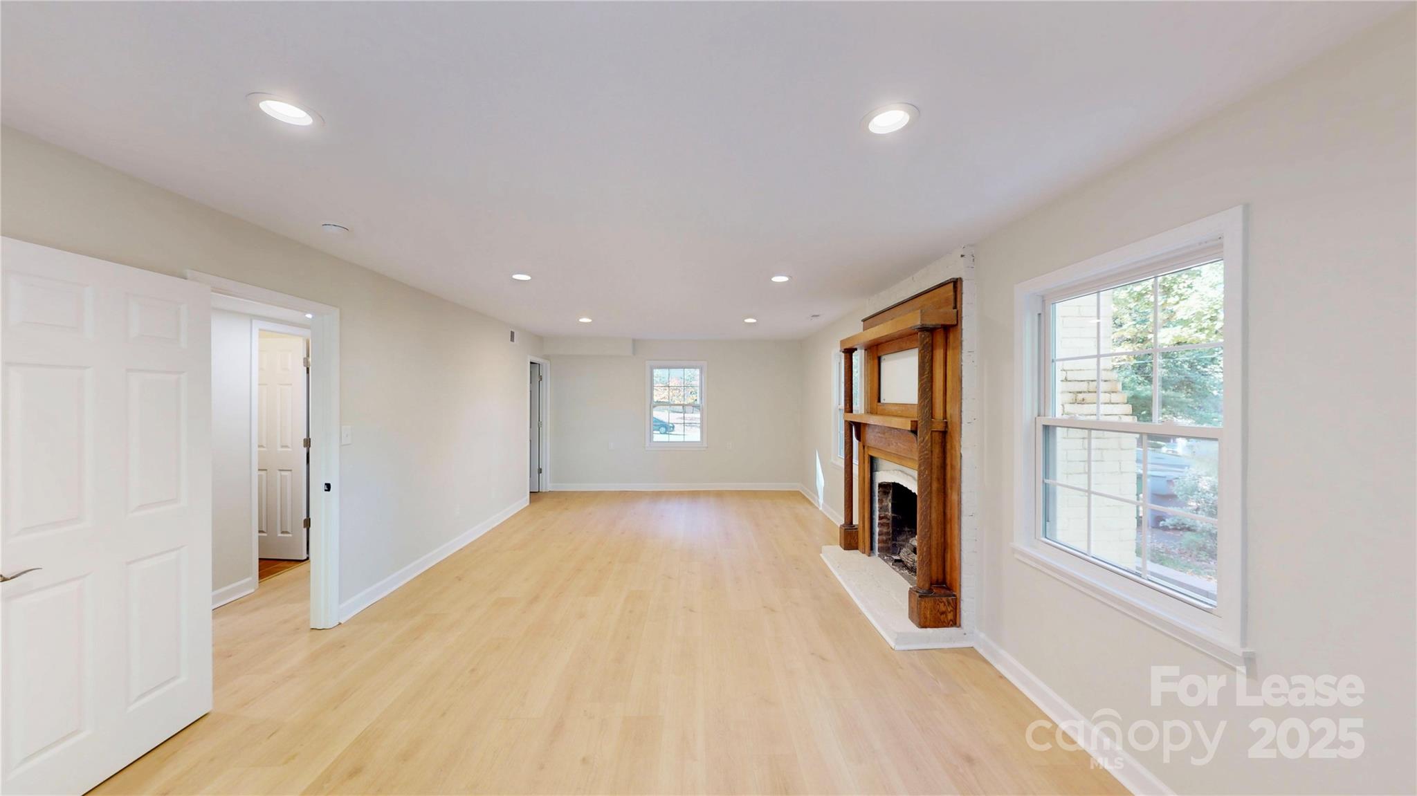 2844 Goneaway Road Charlotte, NC 28210 - Photo 35 of 41 a view of empty room with wooden floor and fan