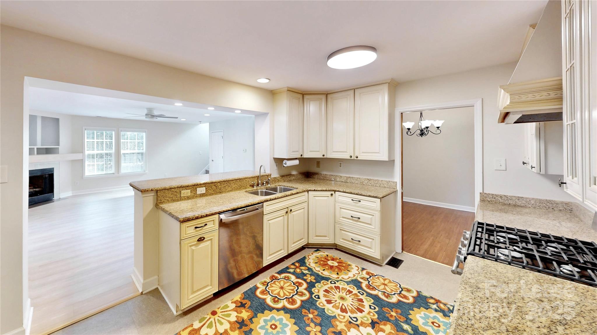 2844 Goneaway Road Charlotte, NC 28210 - Photo 4 of 41 a kitchen with a stove a sink and a refrigerator