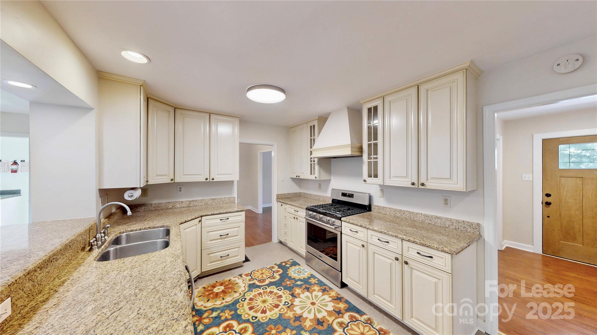2844 Goneaway Road Charlotte, NC 28210 - Photo 6 of 41 a kitchen with stainless steel appliances granite countertop a stove a sink and a refrigerator
