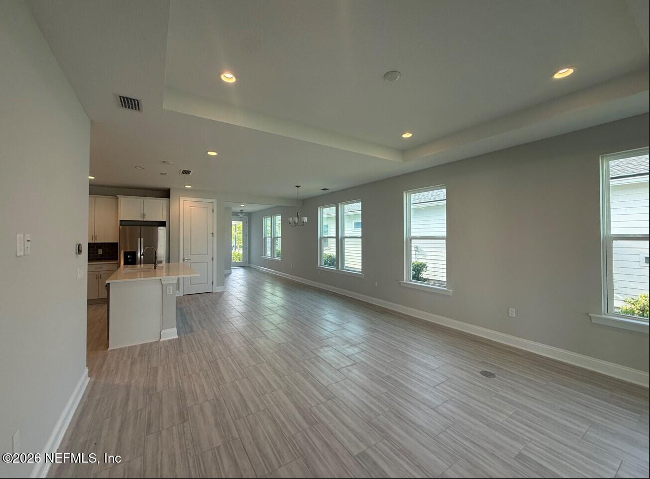 15 Mulberry Road Palm Coast, FL 32164 - Photo 9 of 22 Great Room, Kitchen, Dining to Foyer Ent