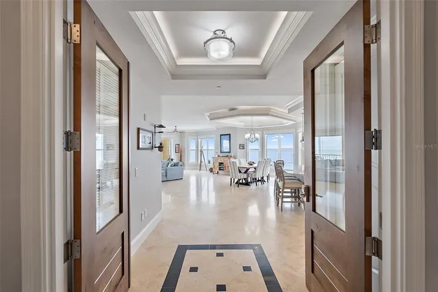 a large white kitchen with a sink appliances and cabinets