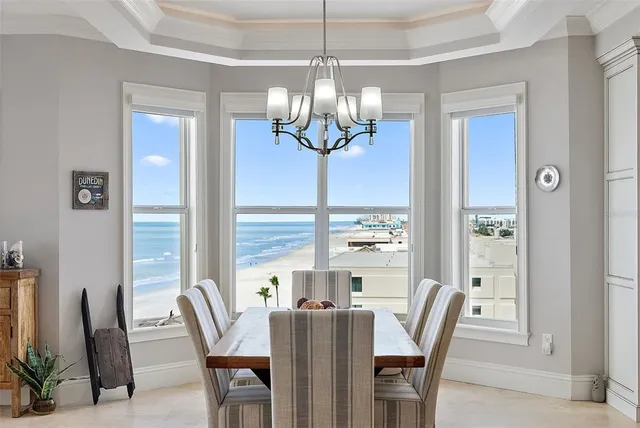 a front view of a building with a garden and pathway