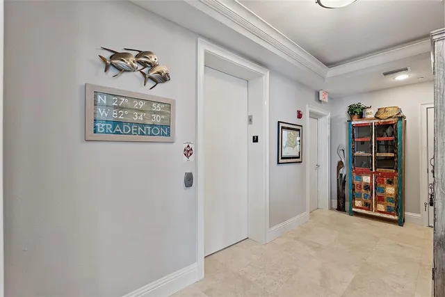 a kitchen with white cabinets and appliances
