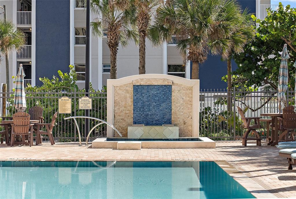13630 Gulf Boulevard, Unit 700C Madeira Beach, FL 33708 - Photo 56 of 78 a view of house with a yard and palm trees