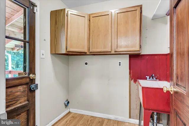a view of room with window and hallway