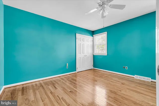 a view of room with window and ceiling fan