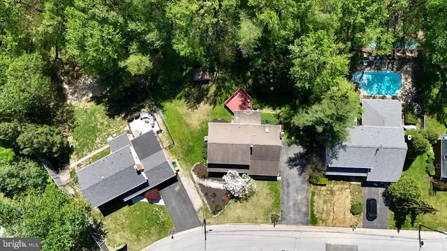 an aerial view of house with yard
