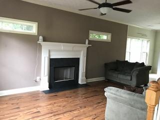 2045 Zellner Road Forsyth, GA 31029 - Photo 3 of 33 a living room with furniture and a fireplace