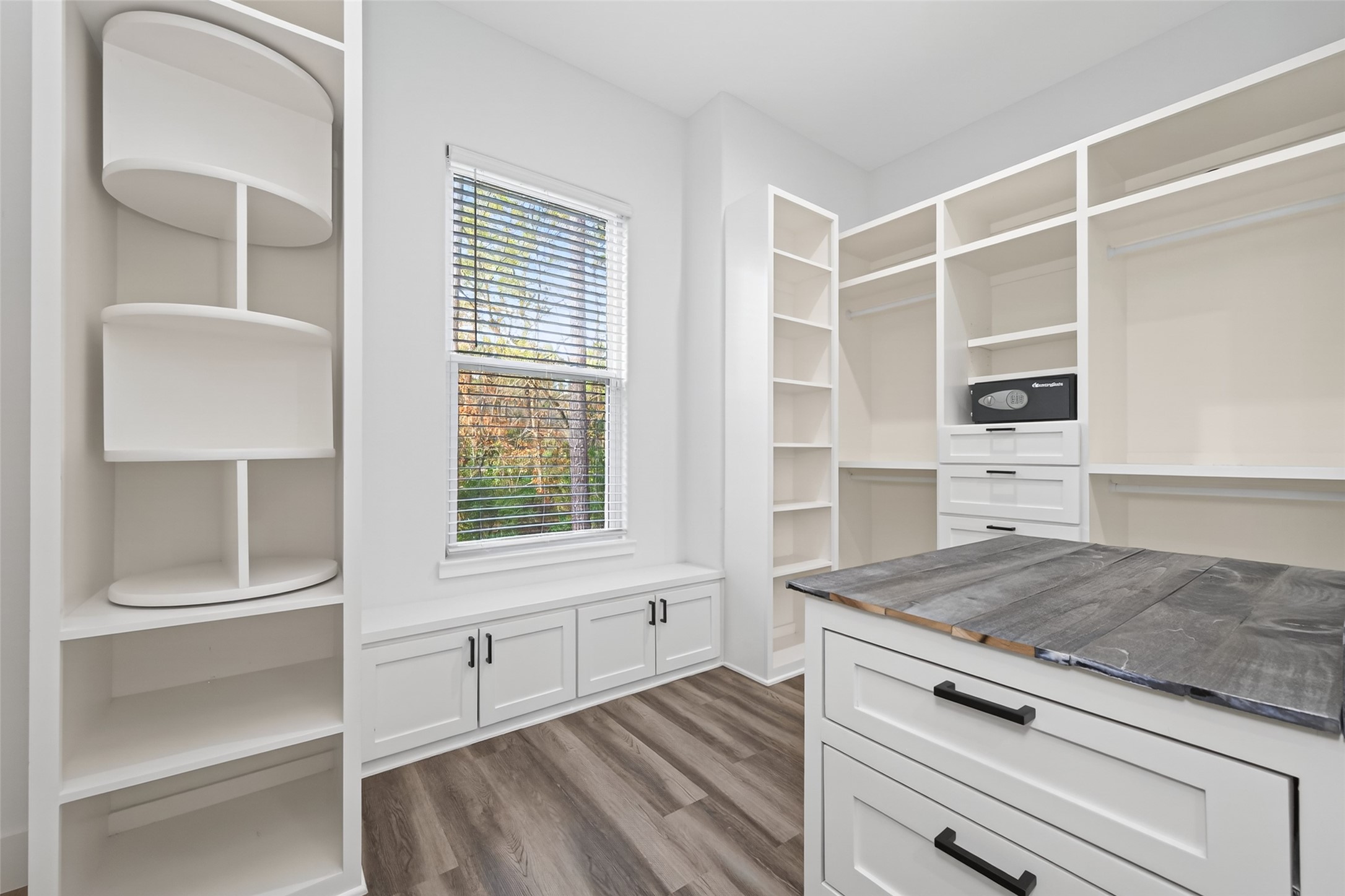 360 Dipping Vat Road Huntsville, TX 77340 - Photo 20 of 38 Primary closet with extensive built ins including spining shoe storage