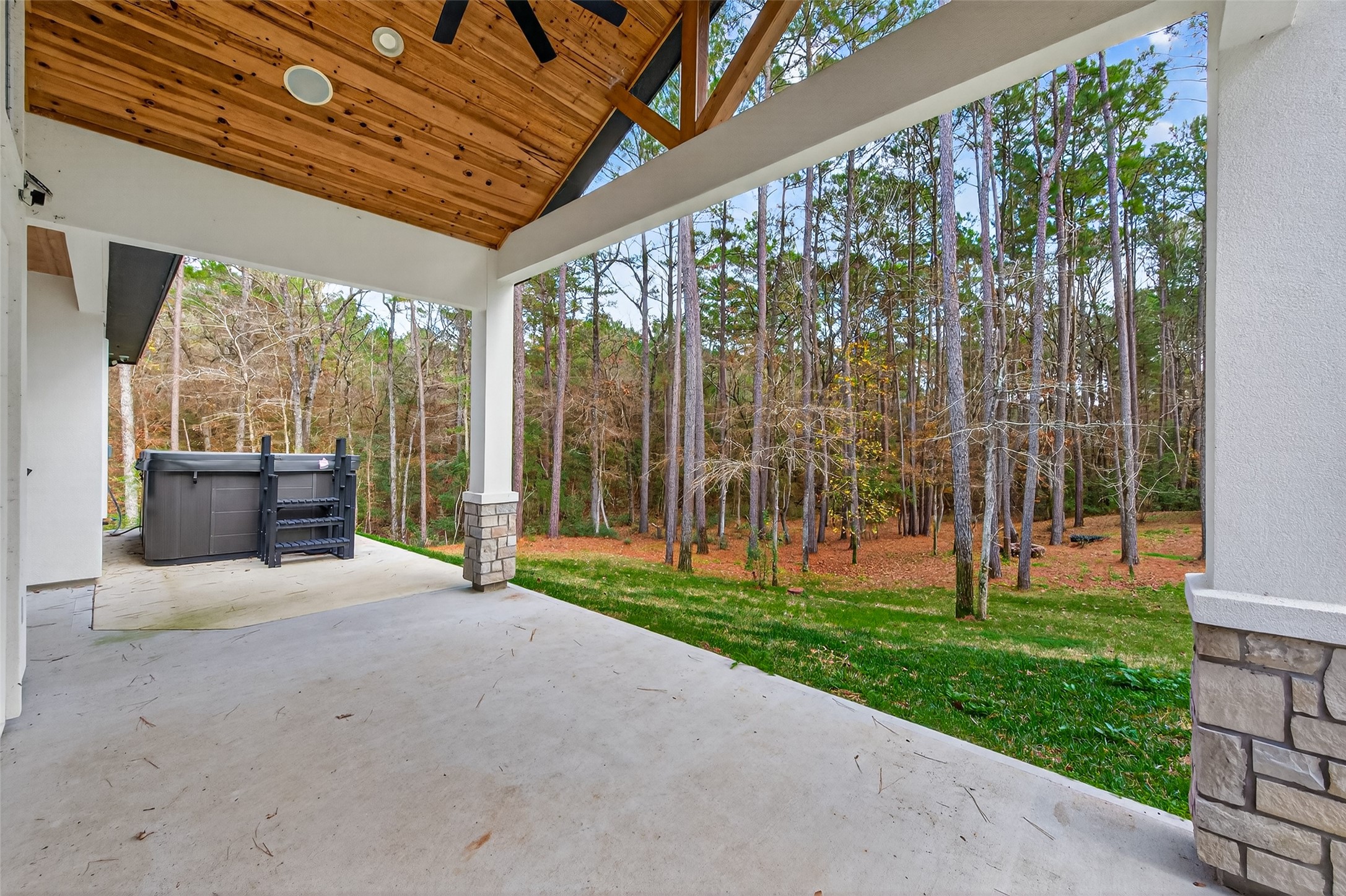 360 Dipping Vat Road Huntsville, TX 77340 - Photo 33 of 38 Large covered deck with swim spa in uncovered area at one side.