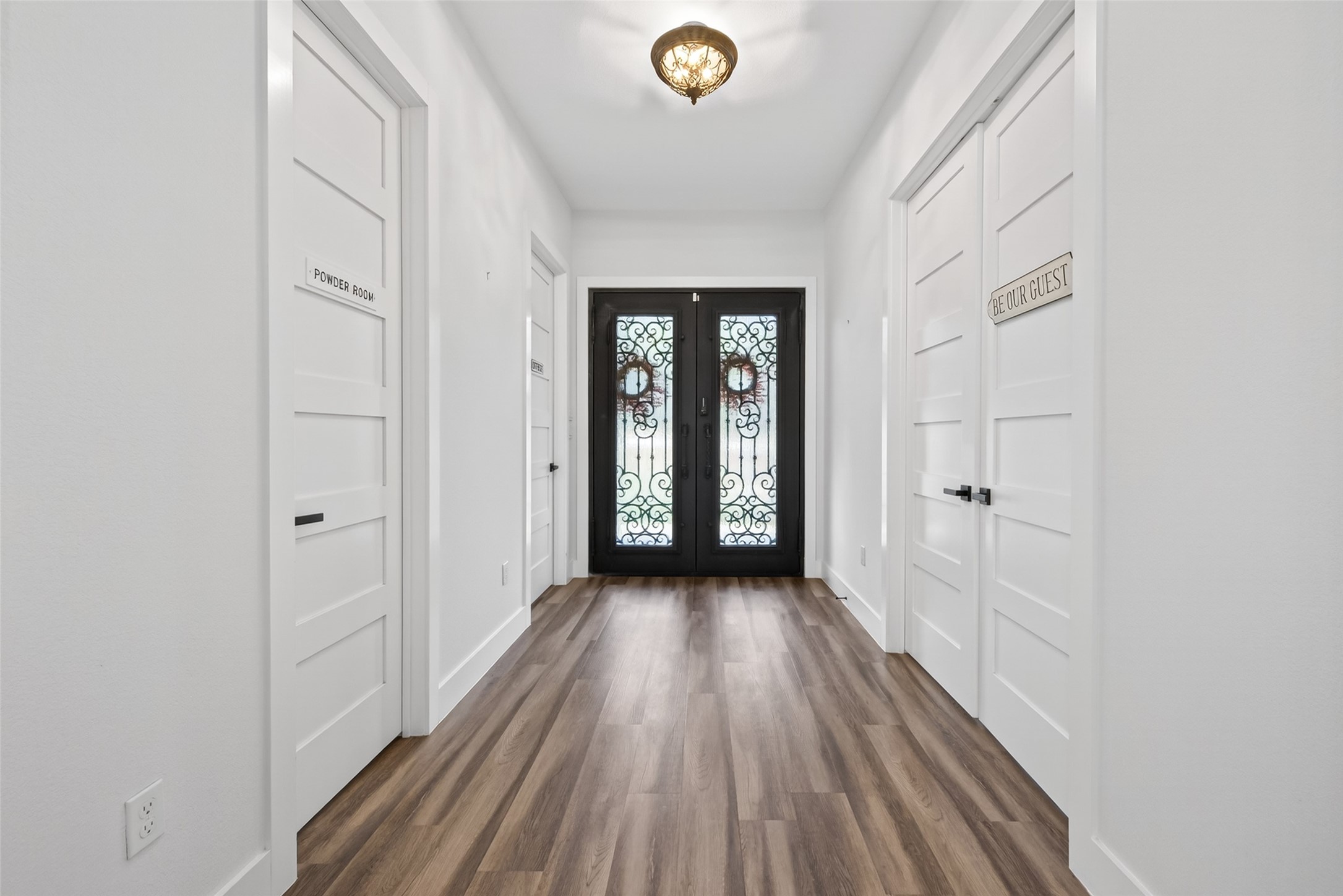 360 Dipping Vat Road Huntsville, TX 77340 - Photo 5 of 38 Entry has beautiful heavy double metal doors. Bedroom 3 to right of picture and Bathroom 3 and Study to Left.