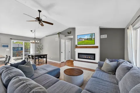 a living room with furniture and a fireplace