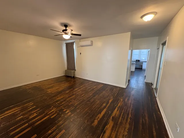 a view of a livingroom with wooden floor
