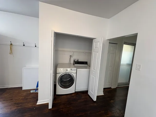 a view of a hallway with washer and dryer