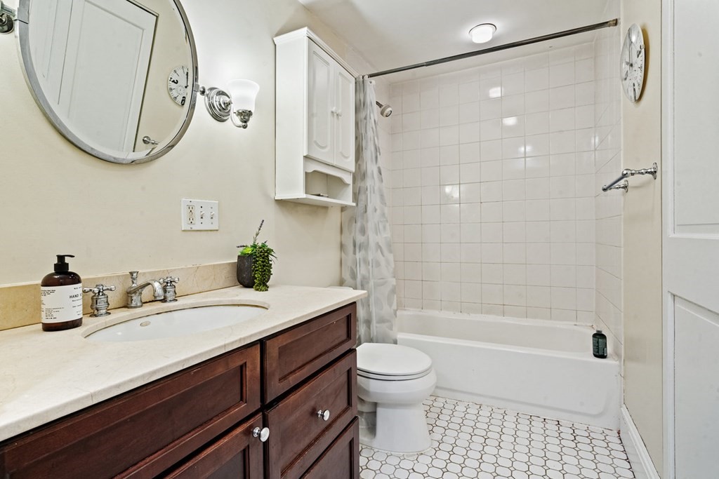 32 Union Park, Unit 2 Boston, MA 02118 - Photo 14 of 19 a bathroom with a sink a toilet and a mirror