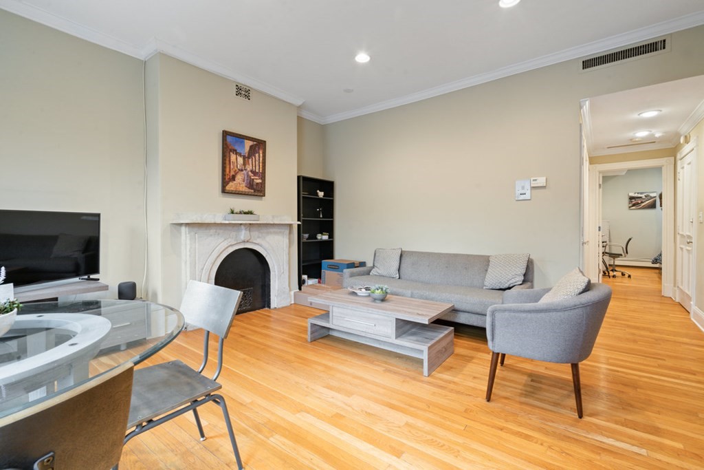 32 Union Park, Unit 2 Boston, MA 02118 - Photo 4 of 19 a view of a livingroom with furniture and a fireplace