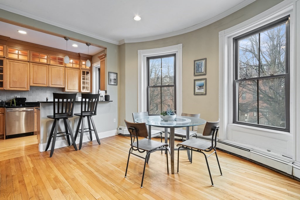 32 Union Park, Unit 2 Boston, MA 02118 - Photo 7 of 19 a view of a dining room with furniture window and wooden floor