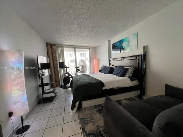 a lobby with furniture and floor to ceiling window