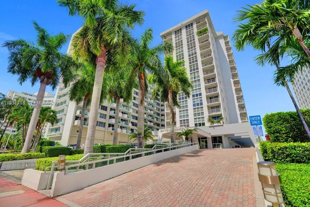 a view of a kitchen with furniture and wooden floor
