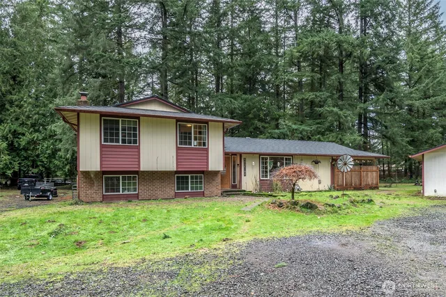 a front view of house with yard and green space