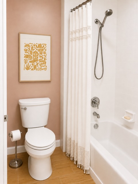 2529 Rio Grande Street, Unit 78 Austin, TX 78705 - Photo 12 of 14 A well-appointed bathroom offers both comfort and a classic shower-over-tub design.