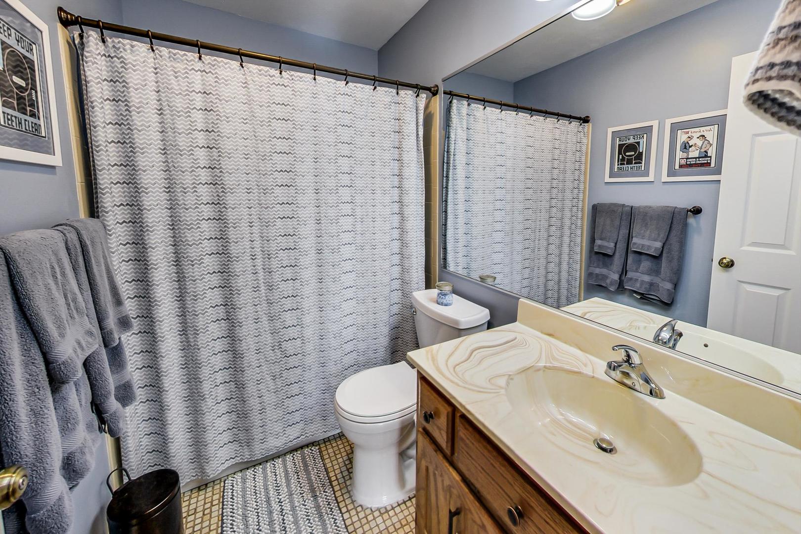N440 Kimball Road Winfield, IL 60190 - Photo 11 of 21 a bathroom with a sink toilet and shower