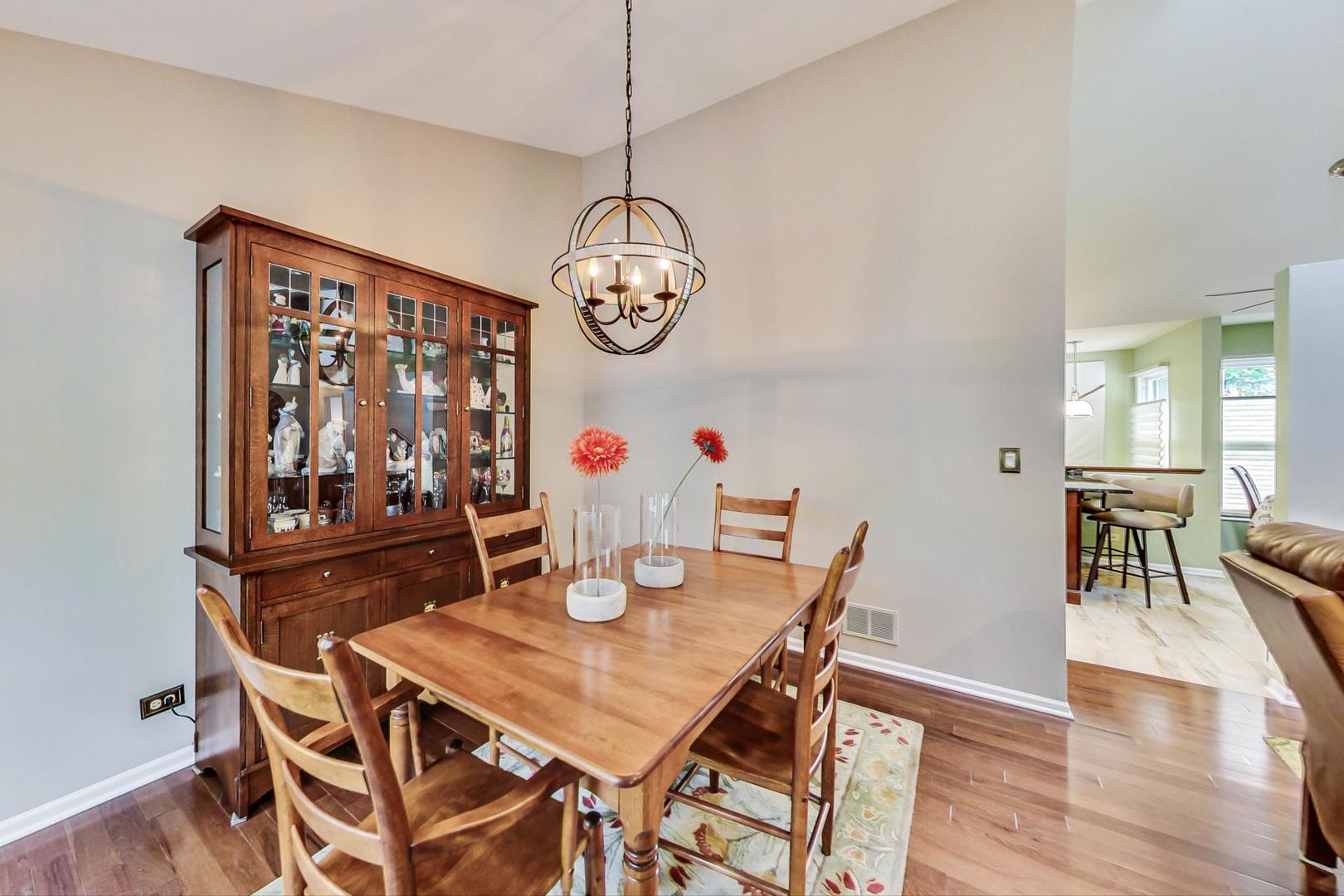 N440 Kimball Road Winfield, IL 60190 - Photo 5 of 21 a view of a dining room with furniture a chandelier and wooden floor