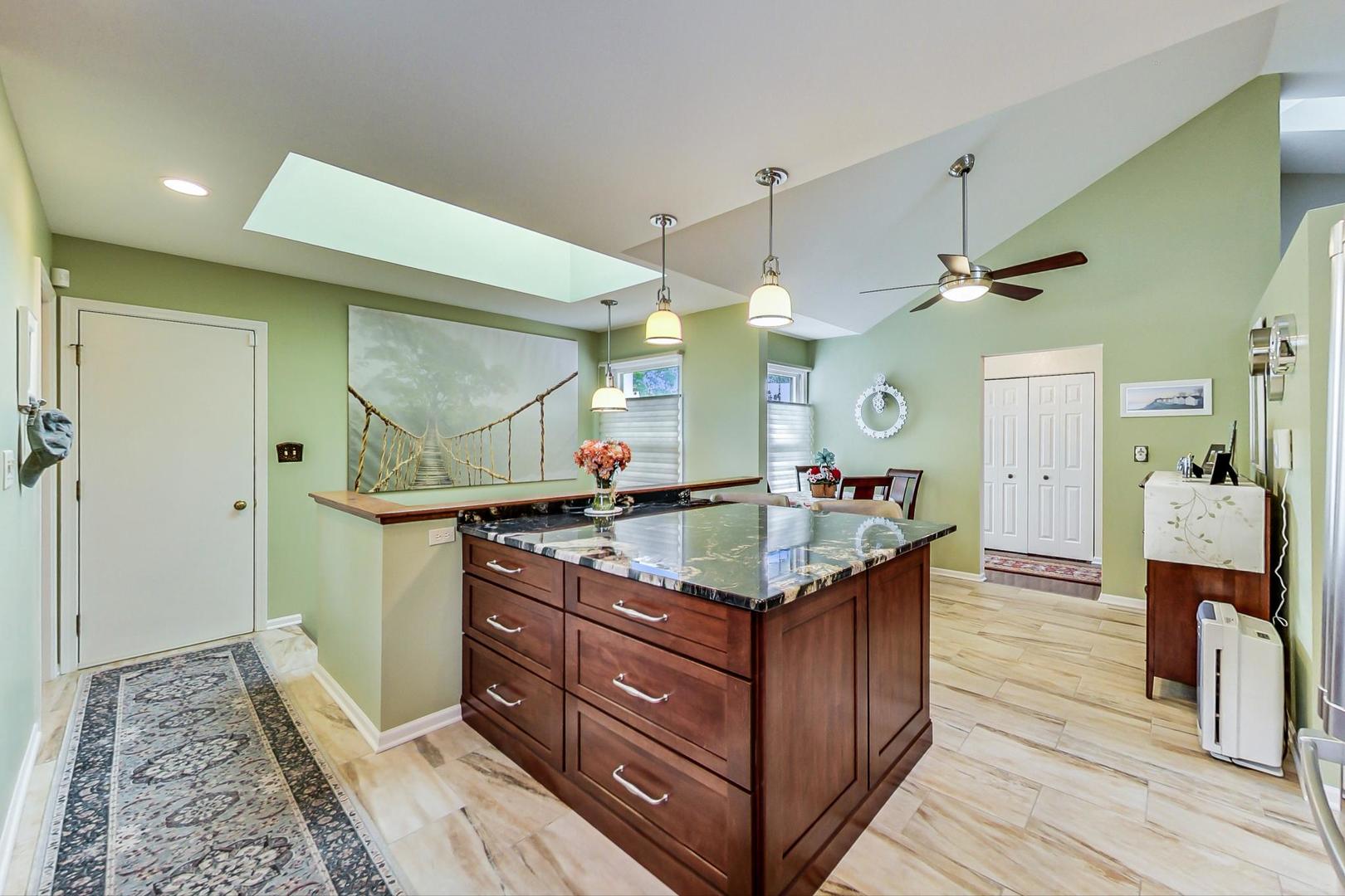 N440 Kimball Road Winfield, IL 60190 - Photo 8 of 21 a bathroom with a granite countertop sink a mirror and a shower