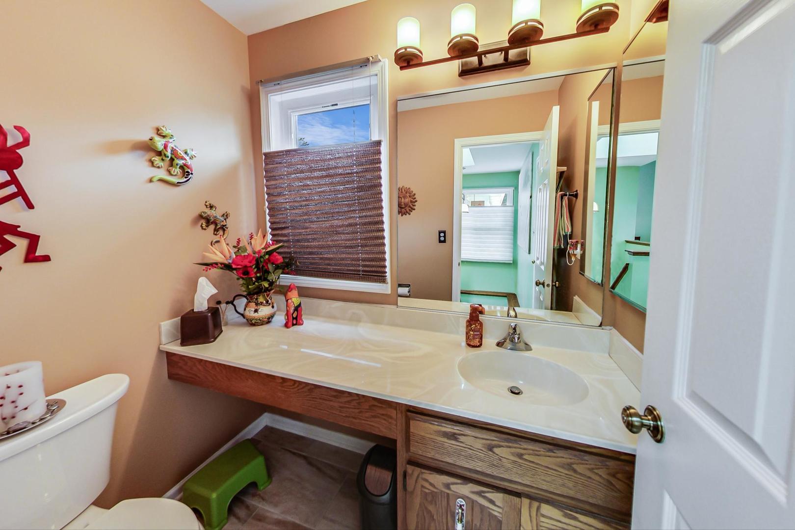 N440 Kimball Road Winfield, IL 60190 - Photo 10 of 21 a bathroom with a sink mirror and toilet
