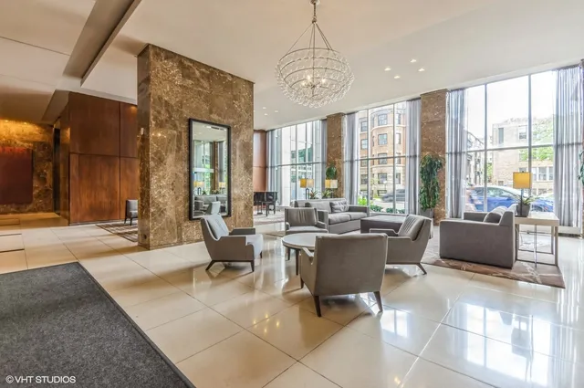 a view of a dining room with furniture large windows and wooden floor