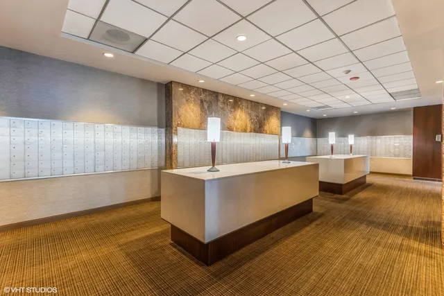 a large white kitchen with a large window